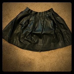 Black embossed "python leather"skater style skirt.